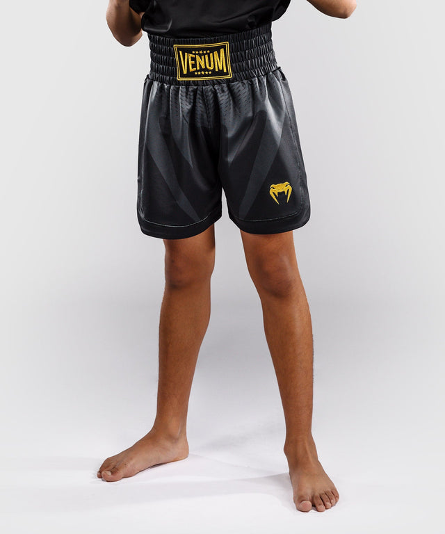 Calções de boxe Venum Attack – Preto/Ouro – Criança