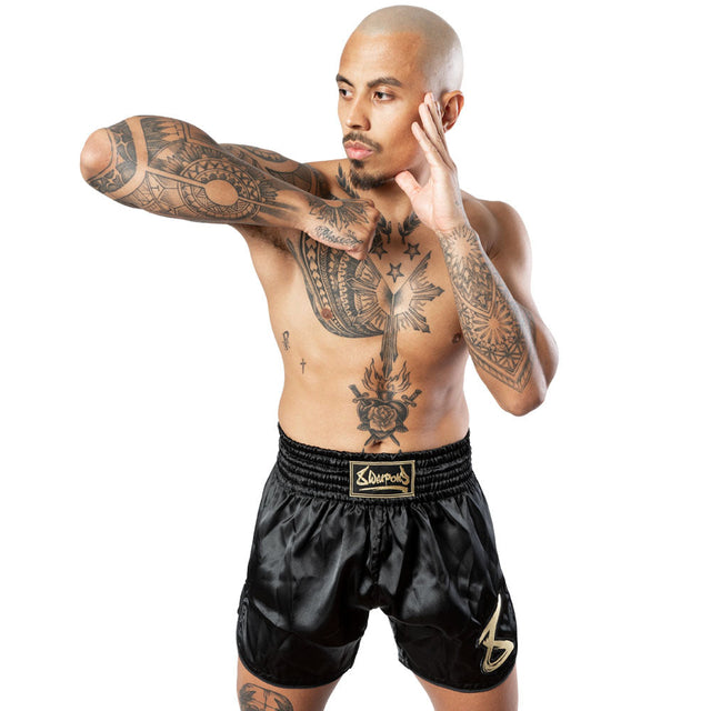 Pantaloncini Muay Thai 8 WEAPONS Strike – Nero/Oro