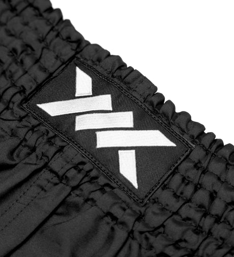 Pantaloni scurți Muay Thai Caged Classic – Negru/Alb femei
