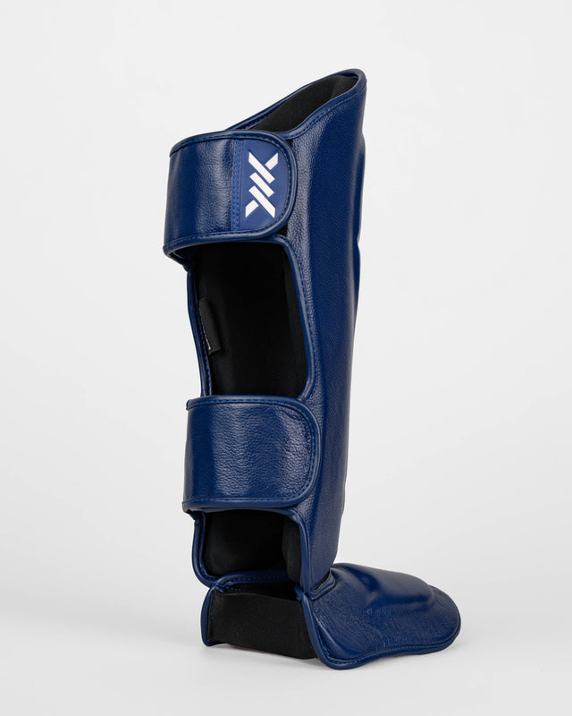 Caged Benskydd 'X' Series – Navy Blå/Vit