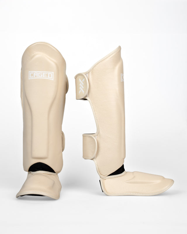 Caged Benskydd 'X' Series – Crème Vit