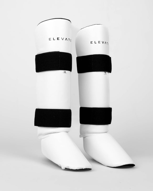 Espinilleras Elevate Prime – Blanco