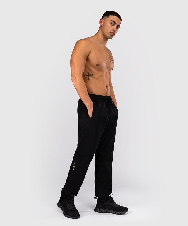 Teplákové kalhoty Venum Training Camp 4.0 – Černé/Neonově zelené