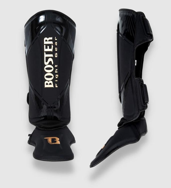 Espinilleras Booster Bangkok – Negro/Oro
