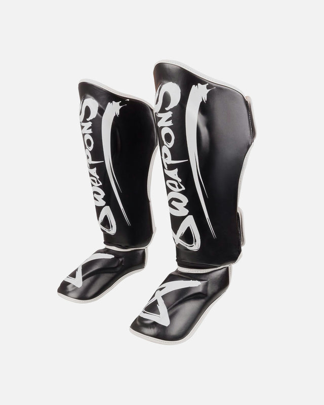 Espinilleras 8 WEAPONS Unlimited 2.0 – Negro/Blanco