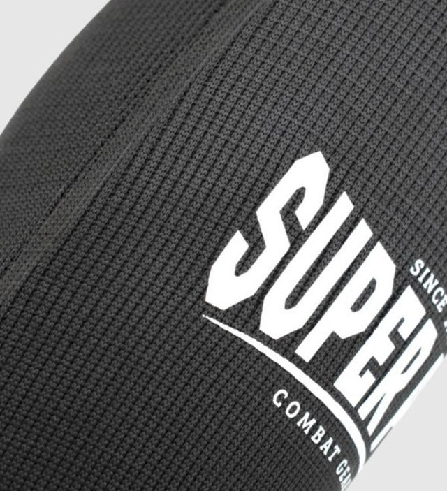 Protège-tibias Super Pro Defender – Noir/Blanc – Protège-tibias